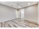 Spacious bedroom with wood-look tile flooring and ample natural light at 172 Petaluma Valley Dr, Las Vegas, NV 89138