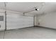 Spacious two car garage featuring sealed concrete floors and overhead door opener at 172 Petaluma Valley Dr, Las Vegas, NV 89138
