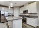 Modern kitchen featuring granite countertops and stainless steel appliances at 172 Petaluma Valley Dr, Las Vegas, NV 89138