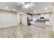 Open-concept living space with wood-look tile flooring and recessed lighting at 172 Petaluma Valley Dr, Las Vegas, NV 89138