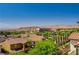 Scenic neighborhood view showcasing lush greenery, tiled rooftops, and mountain views at 172 Petaluma Valley Dr, Las Vegas, NV 89138