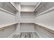 Walk-in closet with multiple shelves and rods at 172 Petaluma Valley Dr, Las Vegas, NV 89138