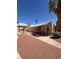 Community clubhouse in a landscaped setting with tile roof and concrete patio at 1830 N Pecos Rd # 155, Las Vegas, NV 89115