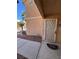 Condominium entrance featuring a decorative security screen door and well-kept landscaping at 1830 N Pecos Rd # 155, Las Vegas, NV 89115