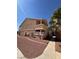 Exterior of a two-story apartment building with red rock landscaping at 1830 N Pecos Rd # 155, Las Vegas, NV 89115