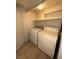 A laundry room featuring a washer and dryer with tile flooring at 1830 N Pecos Rd # 155, Las Vegas, NV 89115