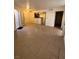 Open-concept living area and kitchen with modern neutral tile flooring and a ceiling fan at 1830 N Pecos Rd # 155, Las Vegas, NV 89115
