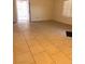 Spacious living room with tile floors, neutral walls, and a view of the entrance at 1830 N Pecos Rd # 155, Las Vegas, NV 89115