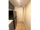 A kitchen pantry with white doors and tile flooring at 1830 N Pecos Rd # 155, Las Vegas, NV 89115