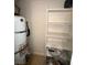 A utility closet with a water heater and shelving at 1830 N Pecos Rd # 155, Las Vegas, NV 89115