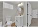 Bathroom featuring gold fixtures, white toilet, and a white vanity at 2112 Santa Ynez Dr, Las Vegas, NV 89104