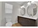 Bathroom featuring a modern double vanity, sleek fixtures, and toilet at 2112 Santa Ynez Dr, Las Vegas, NV 89104