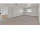 Bright bedroom featuring neutral carpet, ceiling fan, and a view from the window at 2112 Santa Ynez Dr, Las Vegas, NV 89104