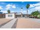Charming single-story home with desert landscaping, covered carport, and a view of the Stratosphere Tower at 2112 Santa Ynez Dr, Las Vegas, NV 89104