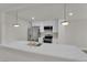 Contemporary kitchen featuring white cabinets, stainless steel appliances, and quartz countertops at 2112 Santa Ynez Dr, Las Vegas, NV 89104