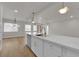Bright, updated kitchen with quartz counters, stainless steel appliances, and seamlessly connects to the living room at 2112 Santa Ynez Dr, Las Vegas, NV 89104