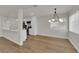 Open-concept living space with updated lighting and flooring, flowing seamlessly into the modern kitchen at 2112 Santa Ynez Dr, Las Vegas, NV 89104