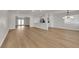 Bright open-concept living room with light wood floors and easy access to the kitchen and outdoor area at 2112 Santa Ynez Dr, Las Vegas, NV 89104