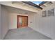 Outdoor space featuring white siding and stained double doors at 2112 Santa Ynez Dr, Las Vegas, NV 89104