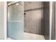 Modern bathroom featuring tiled shower with glass door and a built in shelf niche at 2200 Santa Ynez Dr, Las Vegas, NV 89104