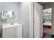 Bathroom with vanity and sink, with a doorway to an adjacent bedroom at 2200 Santa Ynez Dr, Las Vegas, NV 89104
