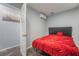 Bedroom featuring bright red duvet, split system air conditioner, and neutral paint at 2200 Santa Ynez Dr, Las Vegas, NV 89104