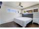 Bright bedroom features hardwood floors, large windows, and wallpaper accent wall at 2200 Santa Ynez Dr, Las Vegas, NV 89104