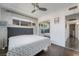 Bedroom features hardwood floors, large window, and sliding closet doors at 2200 Santa Ynez Dr, Las Vegas, NV 89104