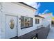 Close up view of the home's front entrance, showcasing the door, window, and architectural details at 2200 Santa Ynez Dr, Las Vegas, NV 89104