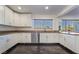 Well-lit kitchen with white cabinets and stainless steel appliances at 2200 Santa Ynez Dr, Las Vegas, NV 89104