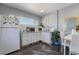Well lit kitchen features white cabinetry, a window, and space for a dining table at 2200 Santa Ynez Dr, Las Vegas, NV 89104