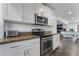 Bright kitchen features stainless steel appliances and white cabinetry at 2200 Santa Ynez Dr, Las Vegas, NV 89104