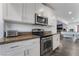Bright kitchen features stainless steel appliances and white cabinetry at 2200 Santa Ynez Dr, Las Vegas, NV 89104