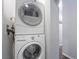 Laundry room featuring a stackable washer and dryer set and neutral paint at 2200 Santa Ynez Dr, Las Vegas, NV 89104