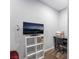 Living room featuring a TV, white shelving, desk, and neutral paint at 2200 Santa Ynez Dr, Las Vegas, NV 89104