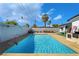 Backyard oasis featuring a refreshing pool, ample deck space, and lush landscaping for private enjoyment at 2200 Santa Ynez Dr, Las Vegas, NV 89104