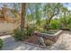 Statue as the centerpiece of a beautifully landscaped yard at 253 White Willow Ave, Las Vegas, NV 89123