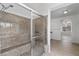 Modern shower stall featuring a glass door and granite wall at 253 White Willow Ave, Las Vegas, NV 89123