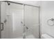Bright bathroom featuring a walk-in shower with glass sliding doors and chrome shower head at 253 White Willow Ave, Las Vegas, NV 89123