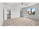 Bright bedroom featuring modern flooring and a view of the outside landscape at 253 White Willow Ave, Las Vegas, NV 89123