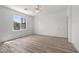 Bright bedroom featuring modern flooring and a view of the outside landscape at 253 White Willow Ave, Las Vegas, NV 89123