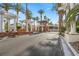 Community entrance with a guard station and palm trees at 253 White Willow Ave, Las Vegas, NV 89123