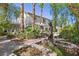 Backyard with beautiful house, statue and seating area at 253 White Willow Ave, Las Vegas, NV 89123