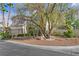 Two-story home with a three-car garage, stucco and brick exterior, and professionally landscaped front yard at 253 White Willow Ave, Las Vegas, NV 89123