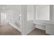 Bright hallway featuring a built-in desk, neutral walls, and modern flooring at 253 White Willow Ave, Las Vegas, NV 89123