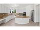White kitchen with granite counters, stainless appliances, and a large island at 253 White Willow Ave, Las Vegas, NV 89123