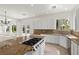 Gourmet kitchen with a center island and granite countertops at 253 White Willow Ave, Las Vegas, NV 89123