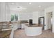Spacious kitchen featuring an island, granite counters, and stainless steel appliances at 253 White Willow Ave, Las Vegas, NV 89123