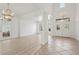 Bright and open living room with a foyer and luxury vinyl plank flooring at 253 White Willow Ave, Las Vegas, NV 89123