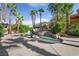 Beautiful pool surrounded by palm trees and lush landscaping at 253 White Willow Ave, Las Vegas, NV 89123